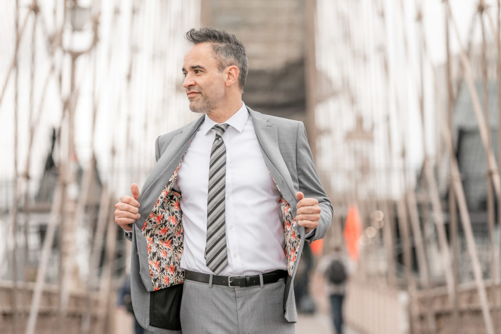 Brooklyn Bridge Wedding Groom Portrait by destination wedding photographer Julie Ferneau