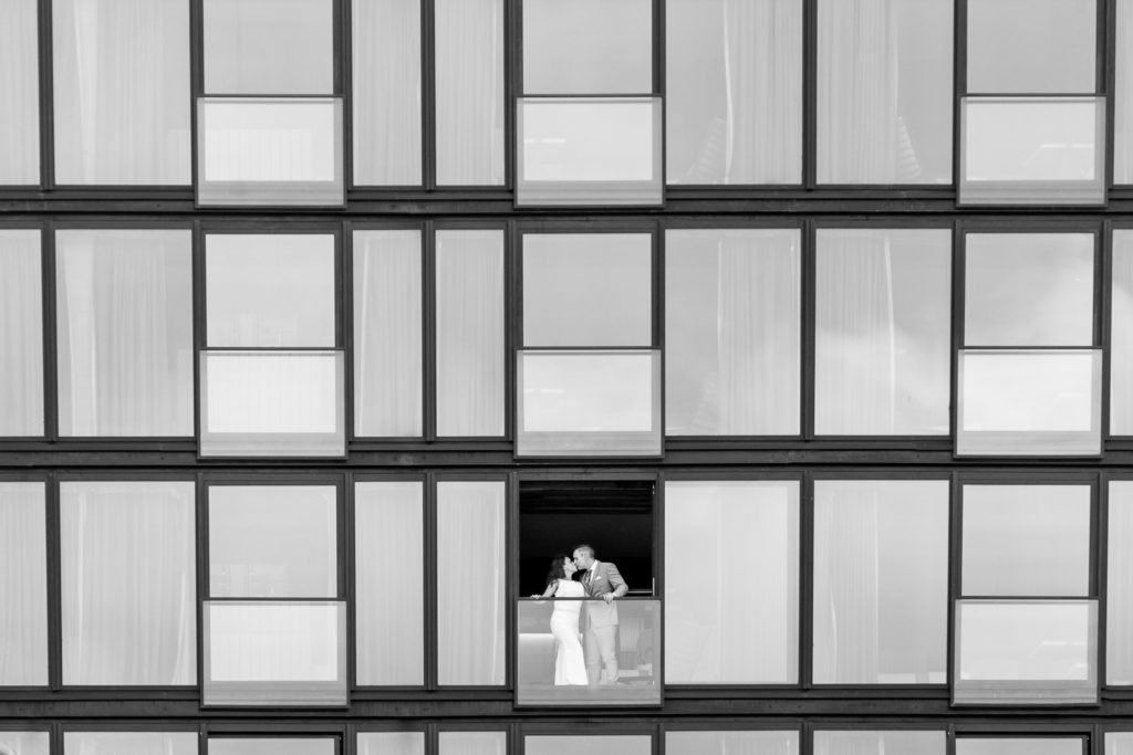 bride and groom kissing by luxury Destination wedding photographer Julie Ferneau Photography